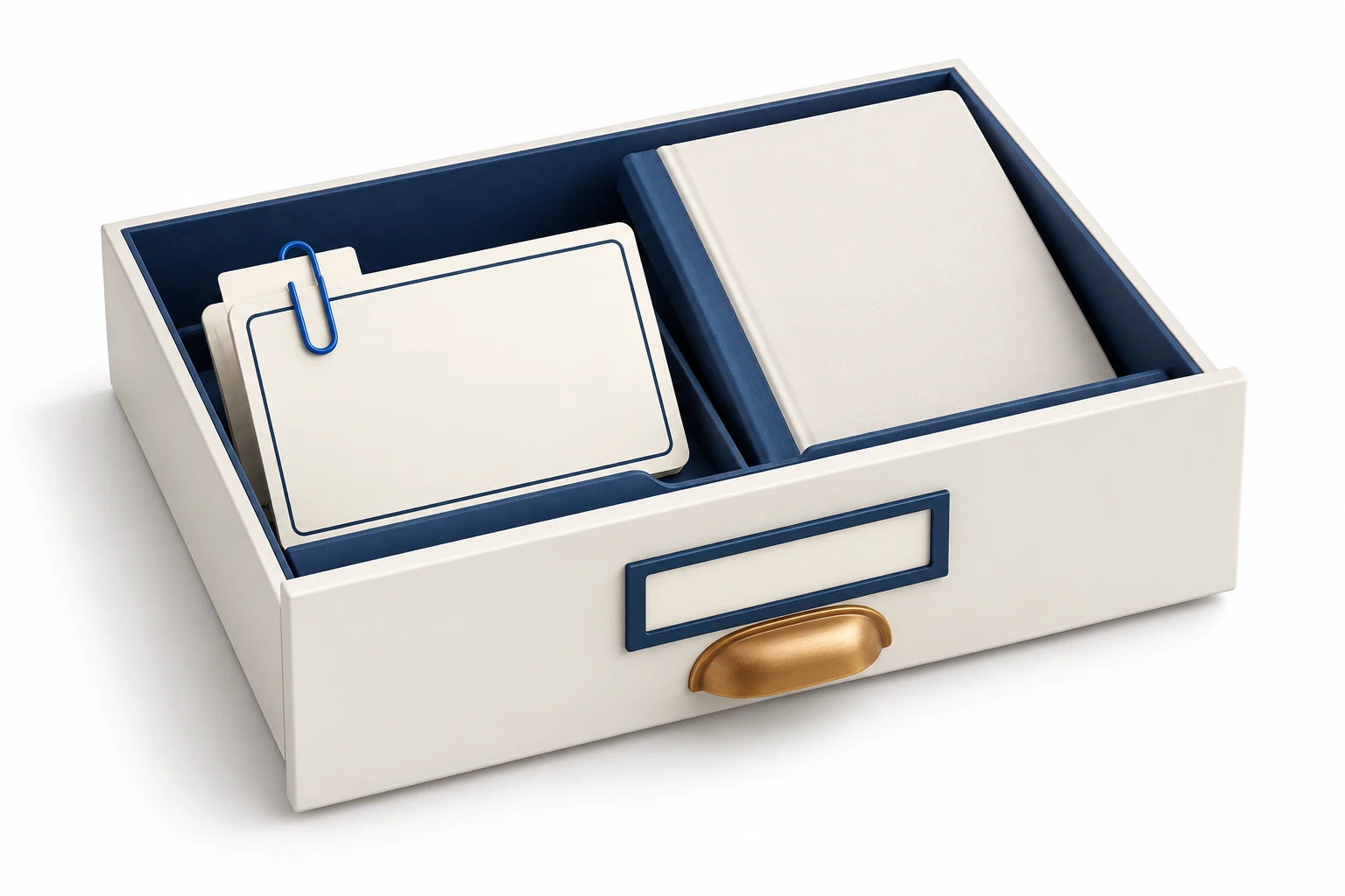 Blank index cards and a reference booklet share a shallow drawer with a blue paper clip.